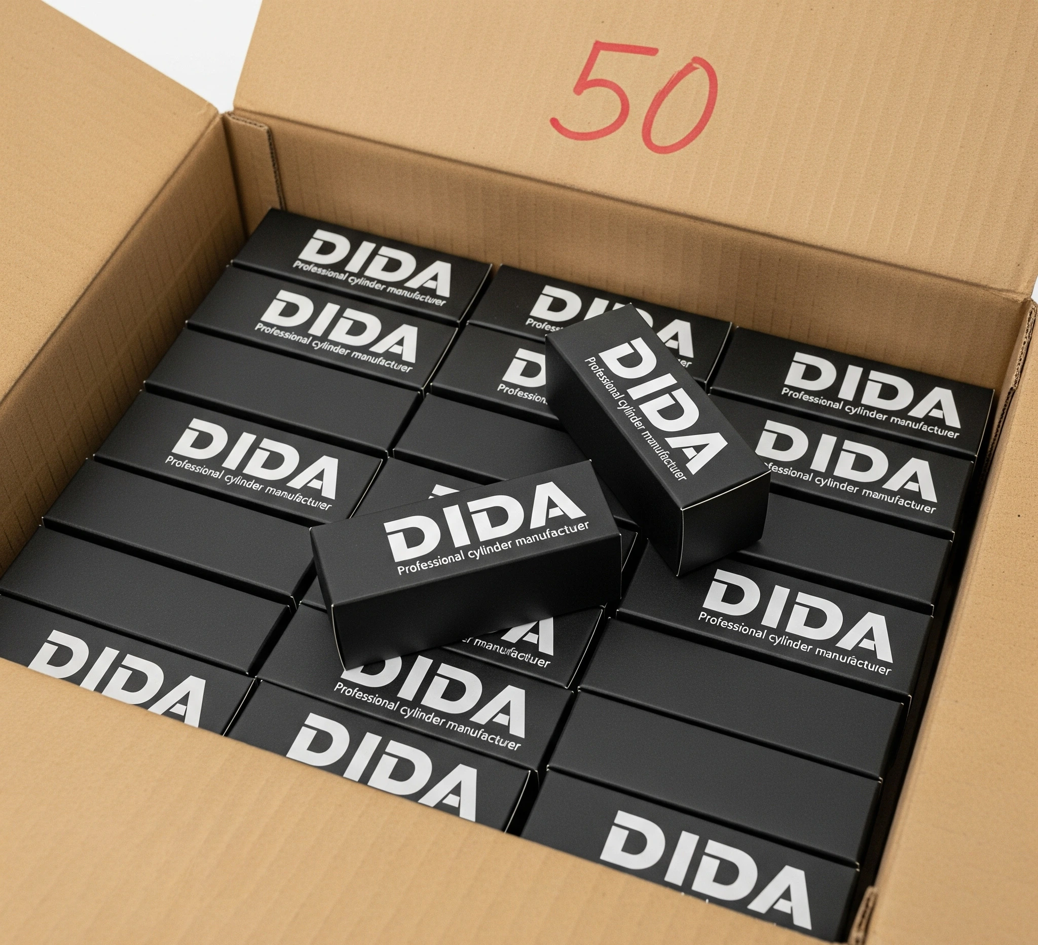 
Open cardboard box filled with multiple black product boxes, each labeled "DIDA," with the number "50" written in red on the inside flap.